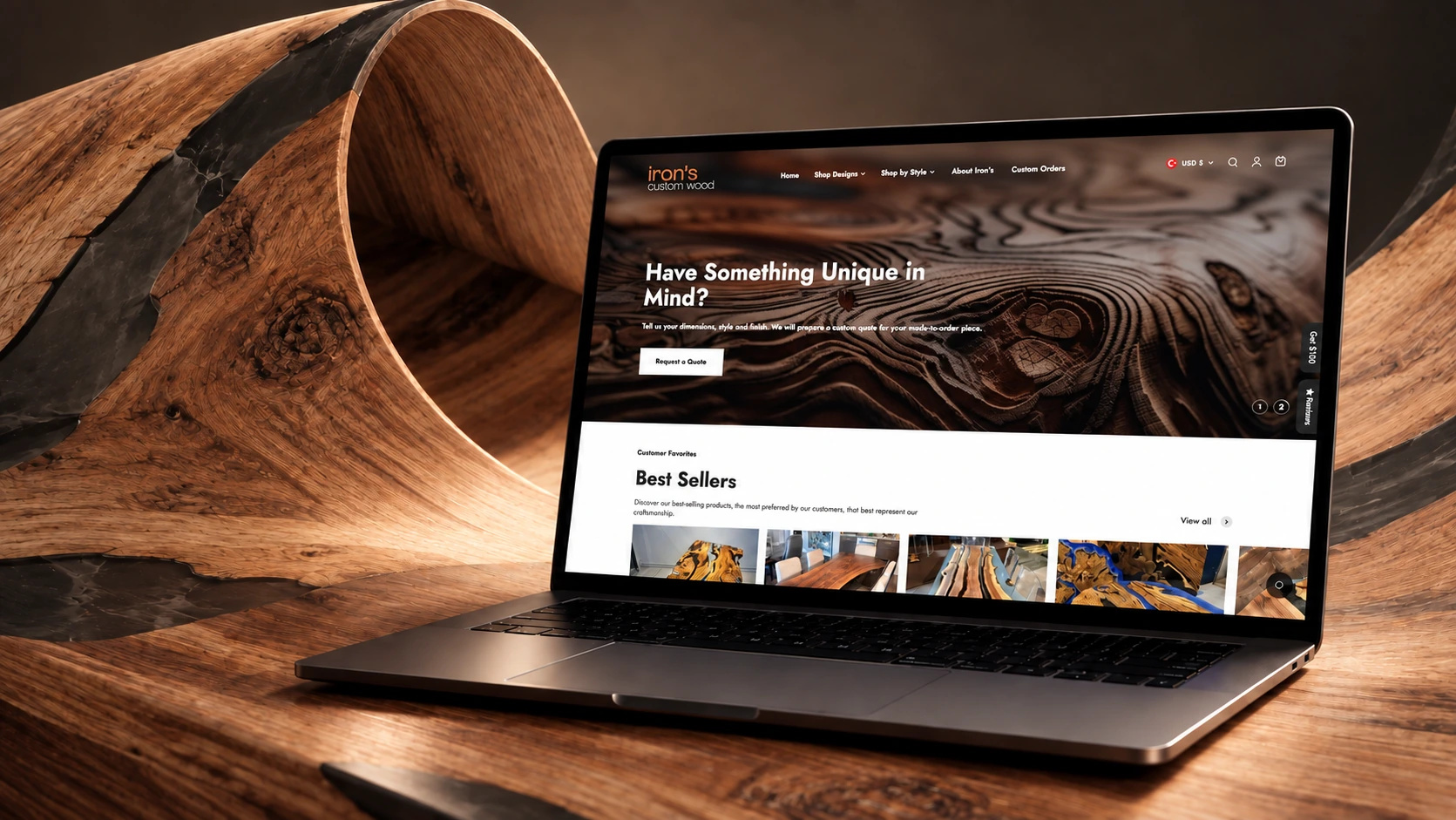 Kıvrılan epoksili ahşap bir levhanın önünde, ekranında Iron’s Custom Wood mağazasının “Have Something Unique in Mind?” açılışı görünen dizüstü bilgisayar