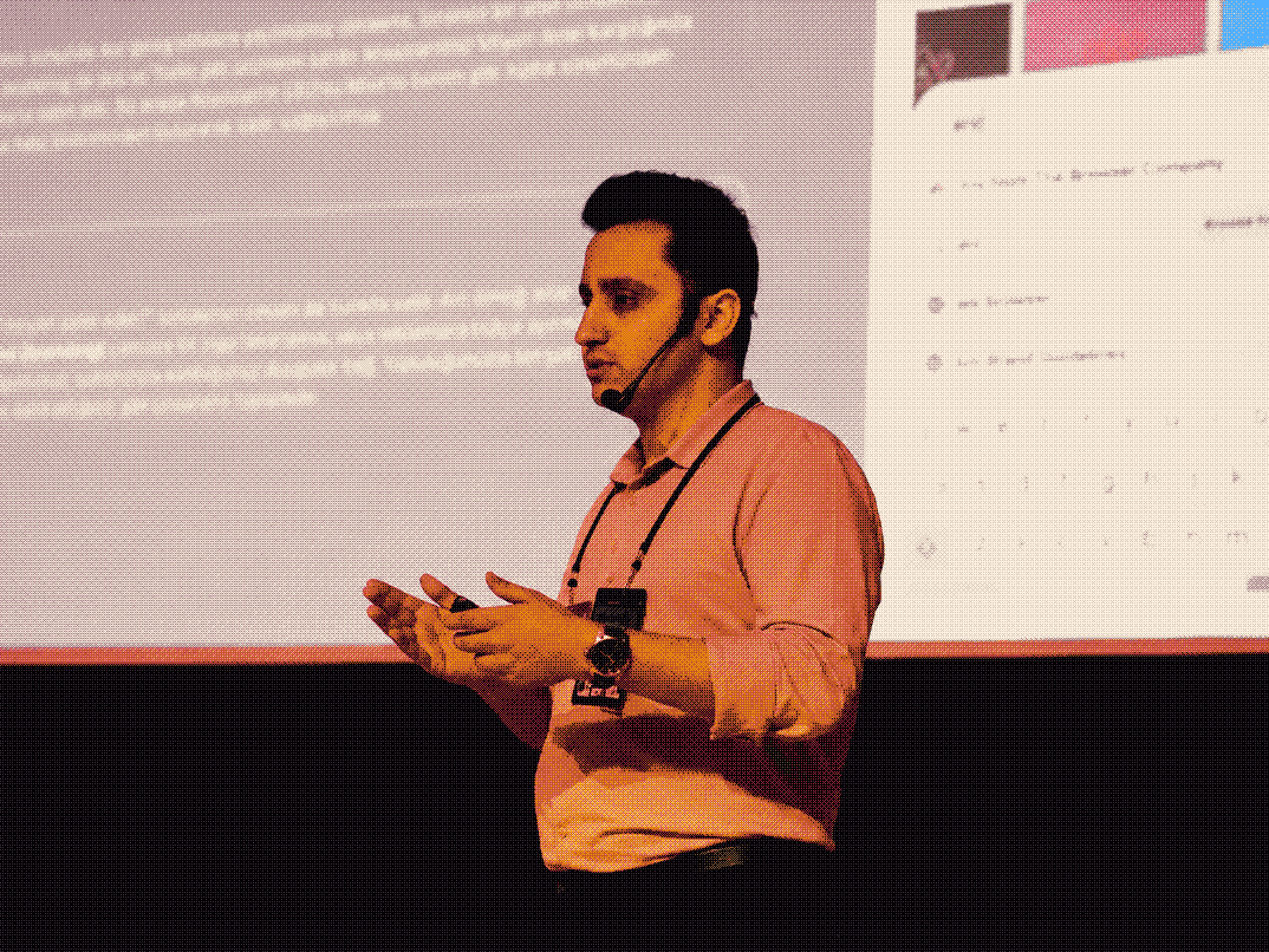 Mustafa Afat speaking on stage at GDG DevFest Gaziantep, with a slide from his talk projected behind him