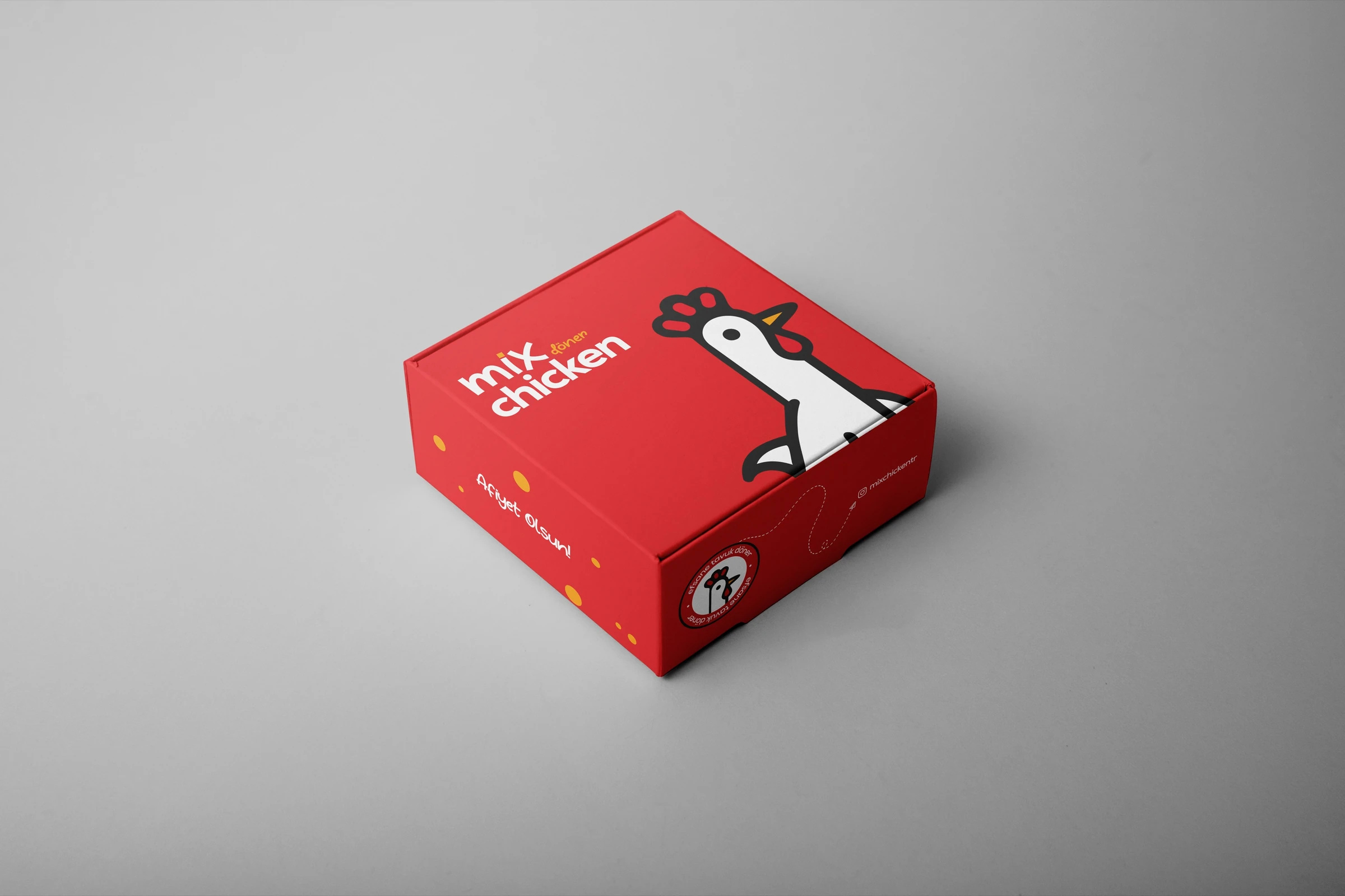 Kapağında Mix Chicken logosu, tavuk karakteri ve “Afiyet Olsun!” yazan kırmızı kare kutu